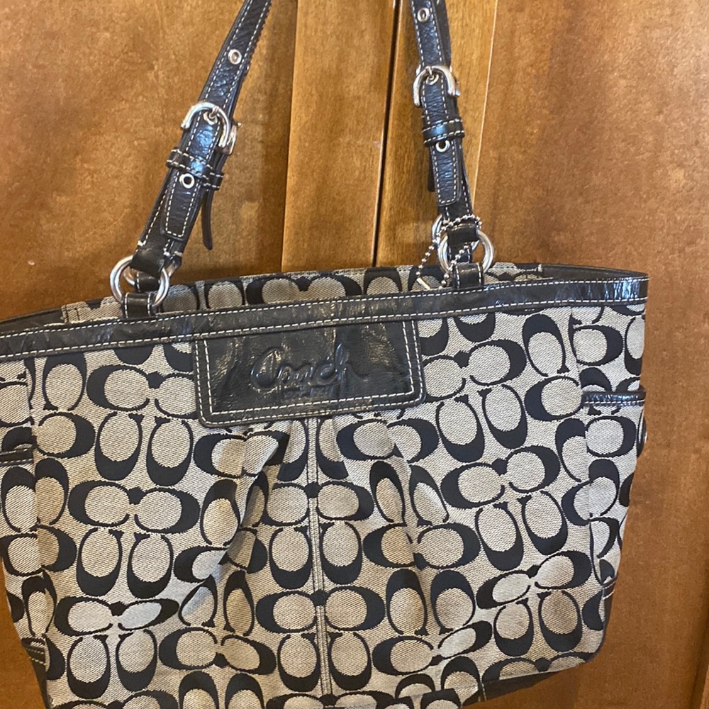 Coach bag. Could use a cleaning at a dry cleaner.  12 x10x4